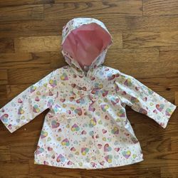White raincoat with heart designs Baby
