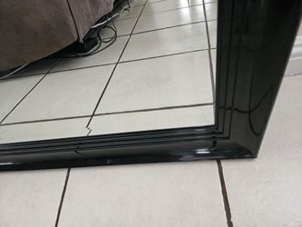 Black framed wall mirror