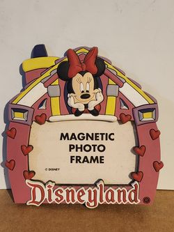 a Minnie Mouse Disneyland magnetic photo frame. 