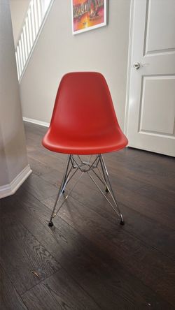 Orange Eames-Style Shell Chair with silver Wire Base