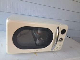 cream-colored Galanz 0.7 cu. ft. Retro Countertop Microwave Oven