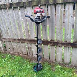 ice auger drill with 8" bit it's 53 ins tall runs great 