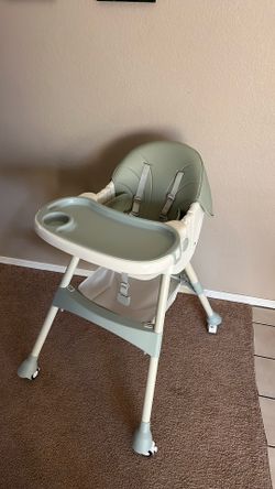 Barely used highchair on wheels