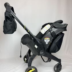 Doona Midnight Edition stroller with accessories 