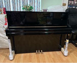 Near new Falcone upright piano for sale