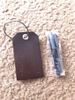 Leather luggage tag with pen