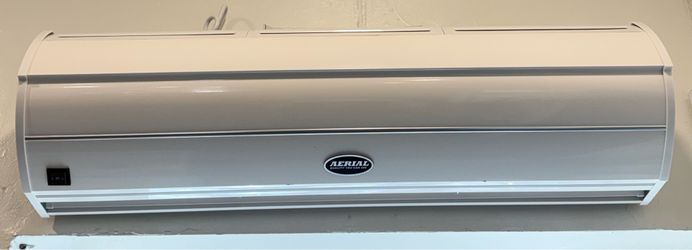 Durasteel wall mounted air curtain for commercial door.