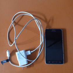 SAMSUNG GALAXY 5.  CELL PHONE CHARGER IS INCLUDED.  