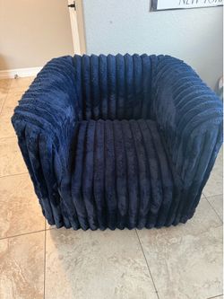 Blue fluffy swivel chair