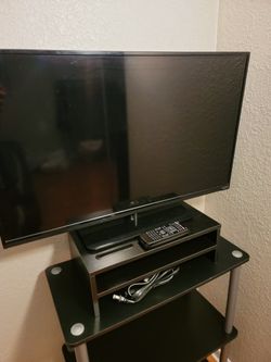 32" TV with stand riser