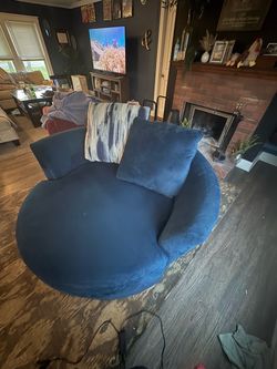 Two person overstuffed swivel round chair