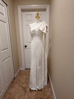 JC Fashion Group Modern One-Shoulder Column Wedding Dress with Statement Bow