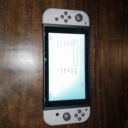 Nintendo Switch console w/ dock, Joy-Con grip & charger