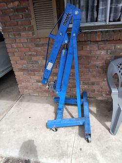 A 2-ton 14000 lb mobile engine hoist it's a power torque .