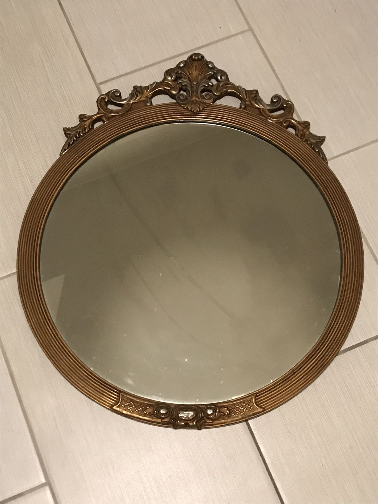 Antique gold round mirror