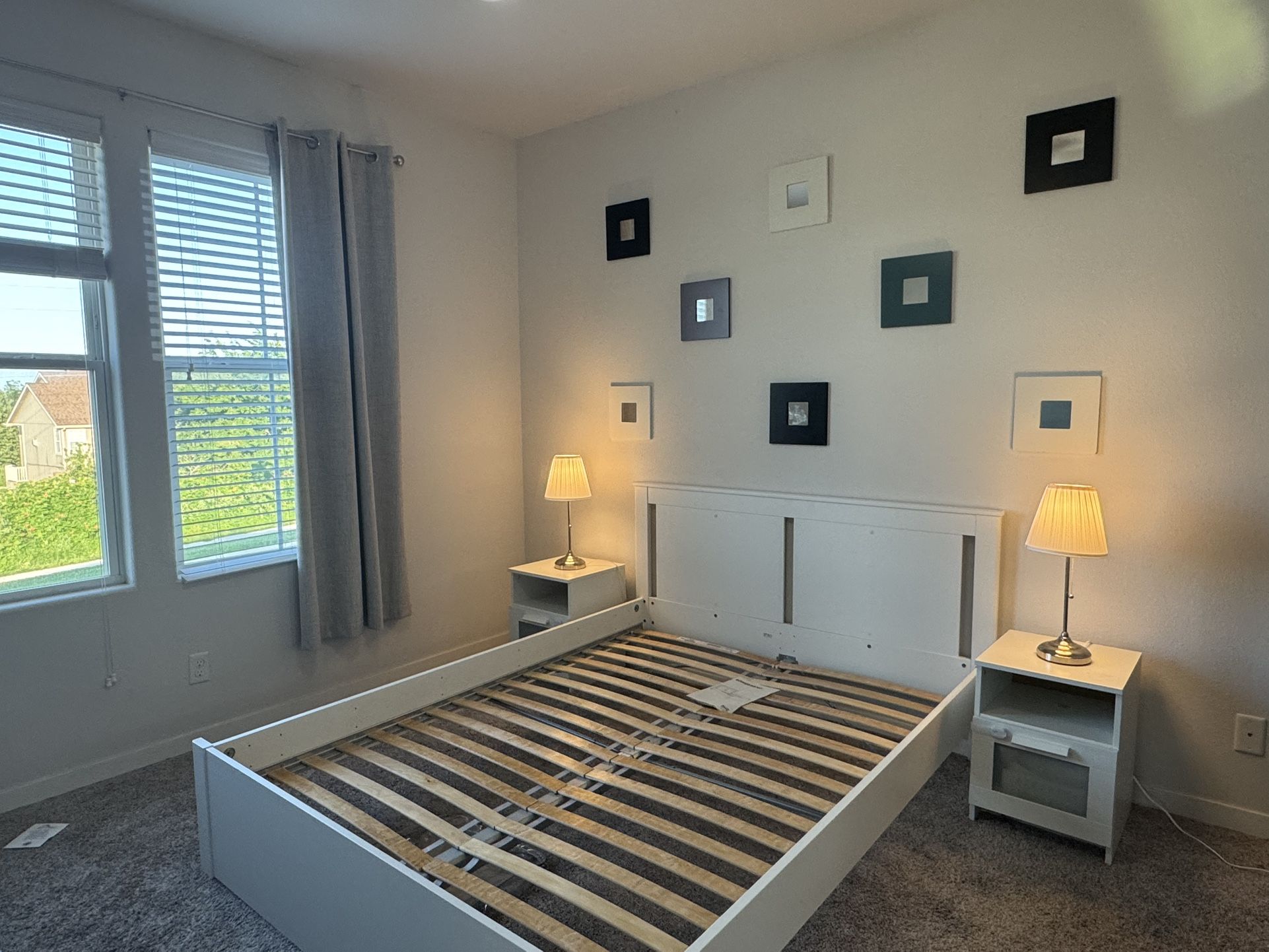 Queen bed | 2 nightstands | 2 table lamps | blackout curtain