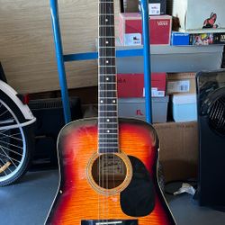 Acoustic Guitar Made By Montana Red And Black And Lion Looking Design On The Front Has Quite A Few Scratches And Dings, But Does Not Affect The Sound 
