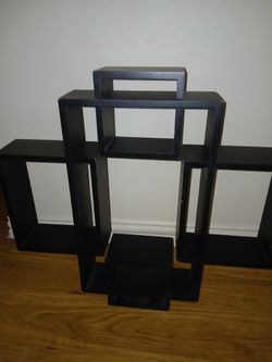 Multiple Sections On This Black Unique Design Of Floating Shelves