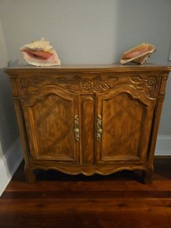 French Provincial Wood Cabinet with Carved Detail