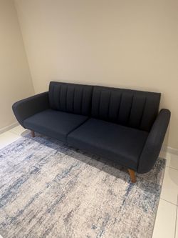 Blue futon + rug