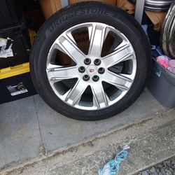 4 used tires and rims for a Cadillac 6 lug 20 inch