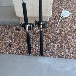 2 fishing rods and reels 15 -40 and 10-25    7