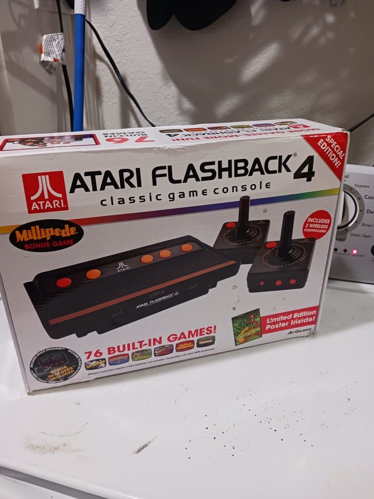ATARI FLASHBACK 4 Classic game controller. Good Condition. 76 built in games. includes 2 wireless controllers.