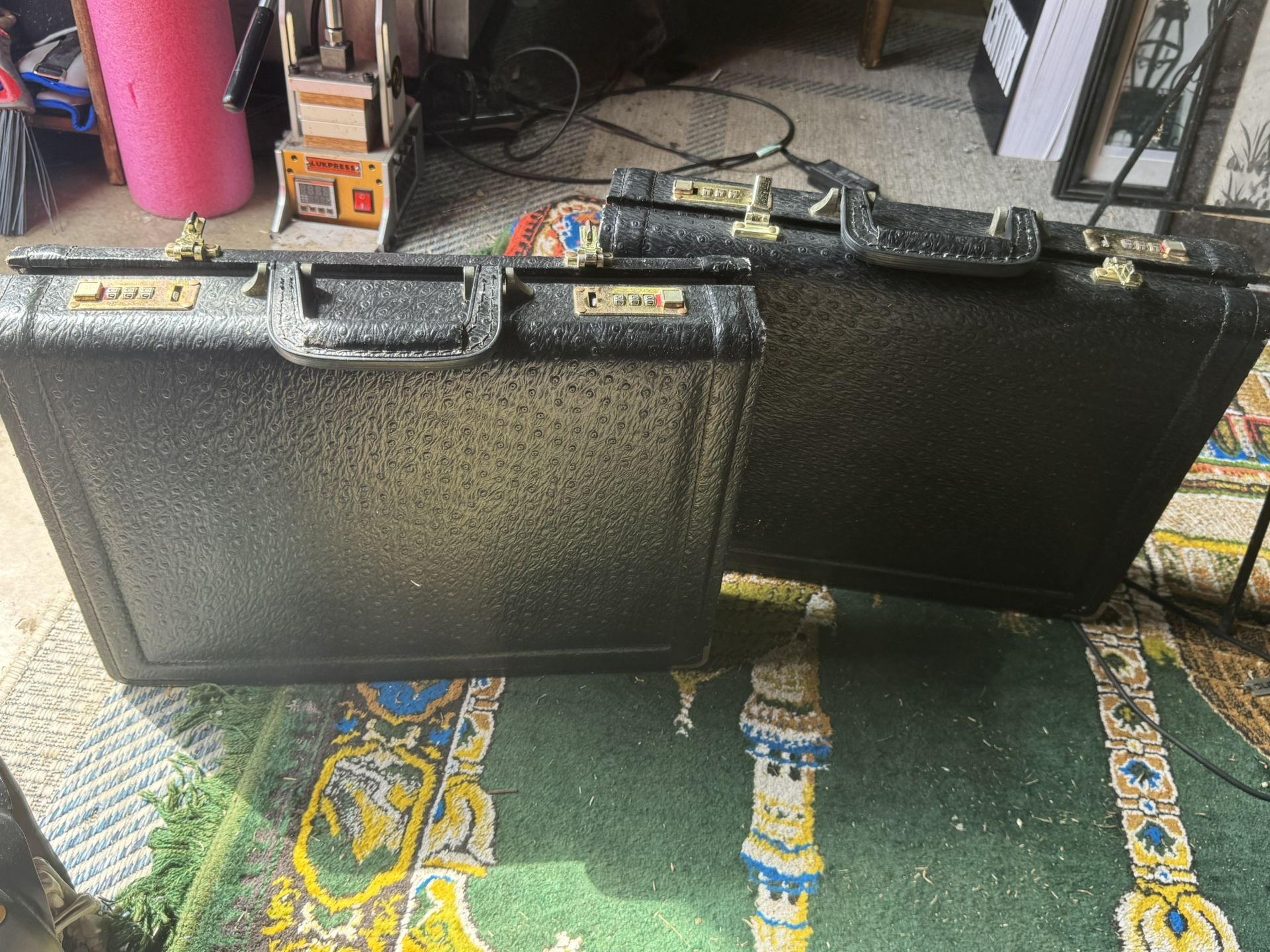 vintage black hard-shell attaché case or briefcase with dual combination locks. $45 Each