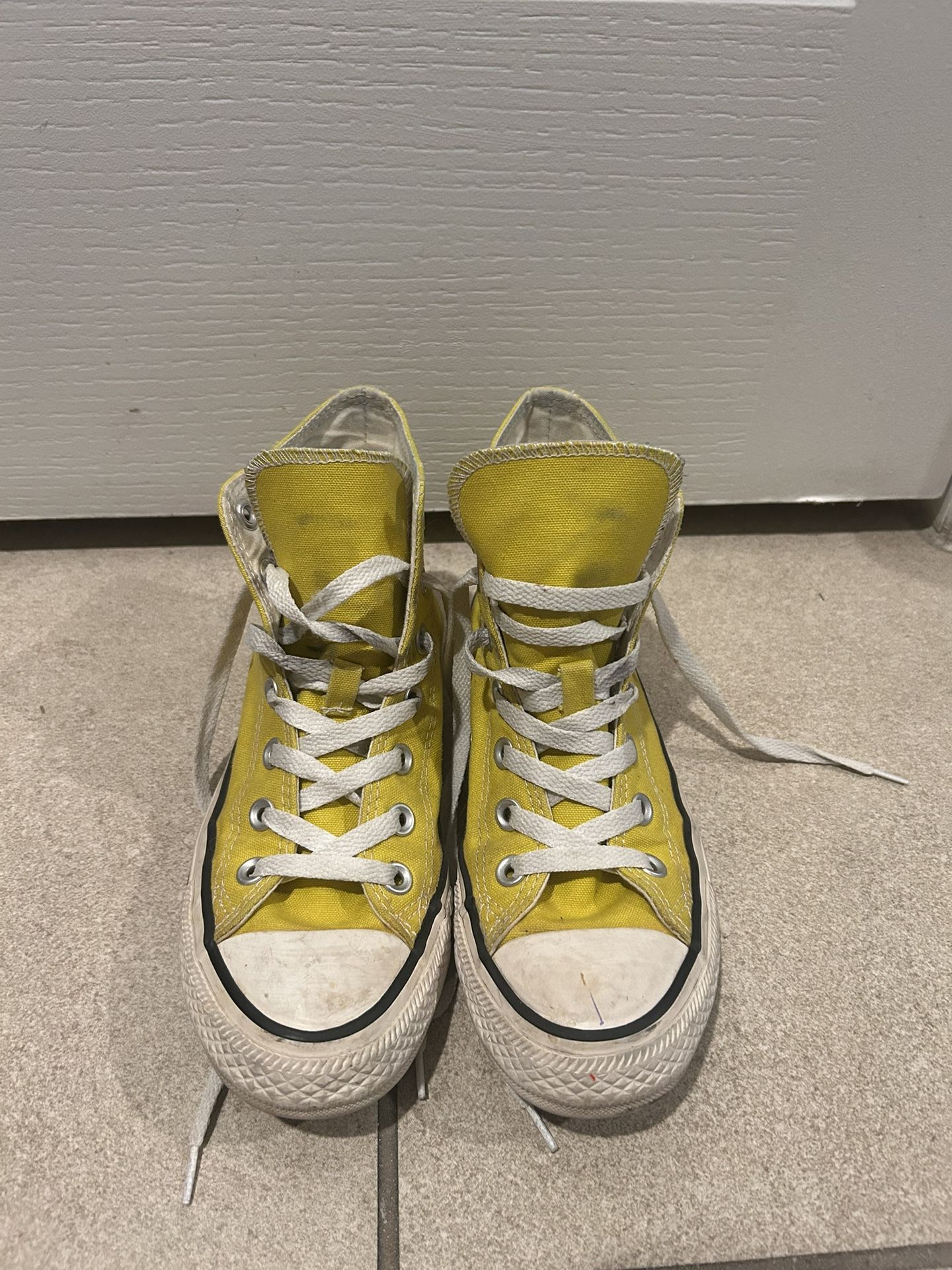 yellow Converse high tops