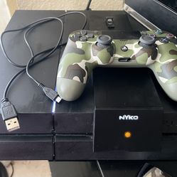 PlayStation 4 Console, A DualShock 4 Controller, And A Nyko Charging Base.   PRICE IS FIRM