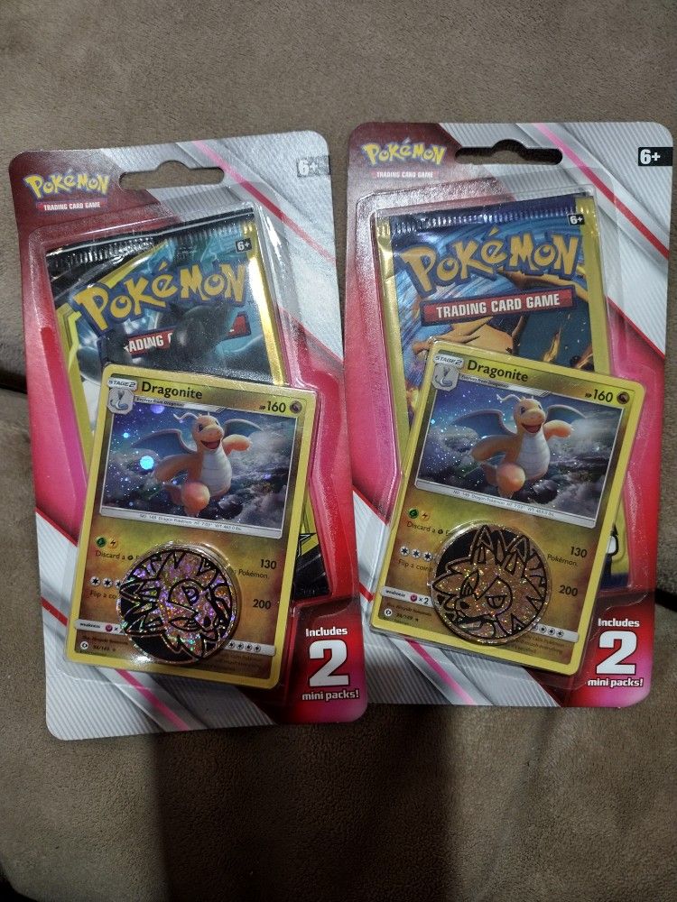 Two Pokemon Card Packs Each Contains 2 Mini Packs Plus A Metallic Coin . Sealed.