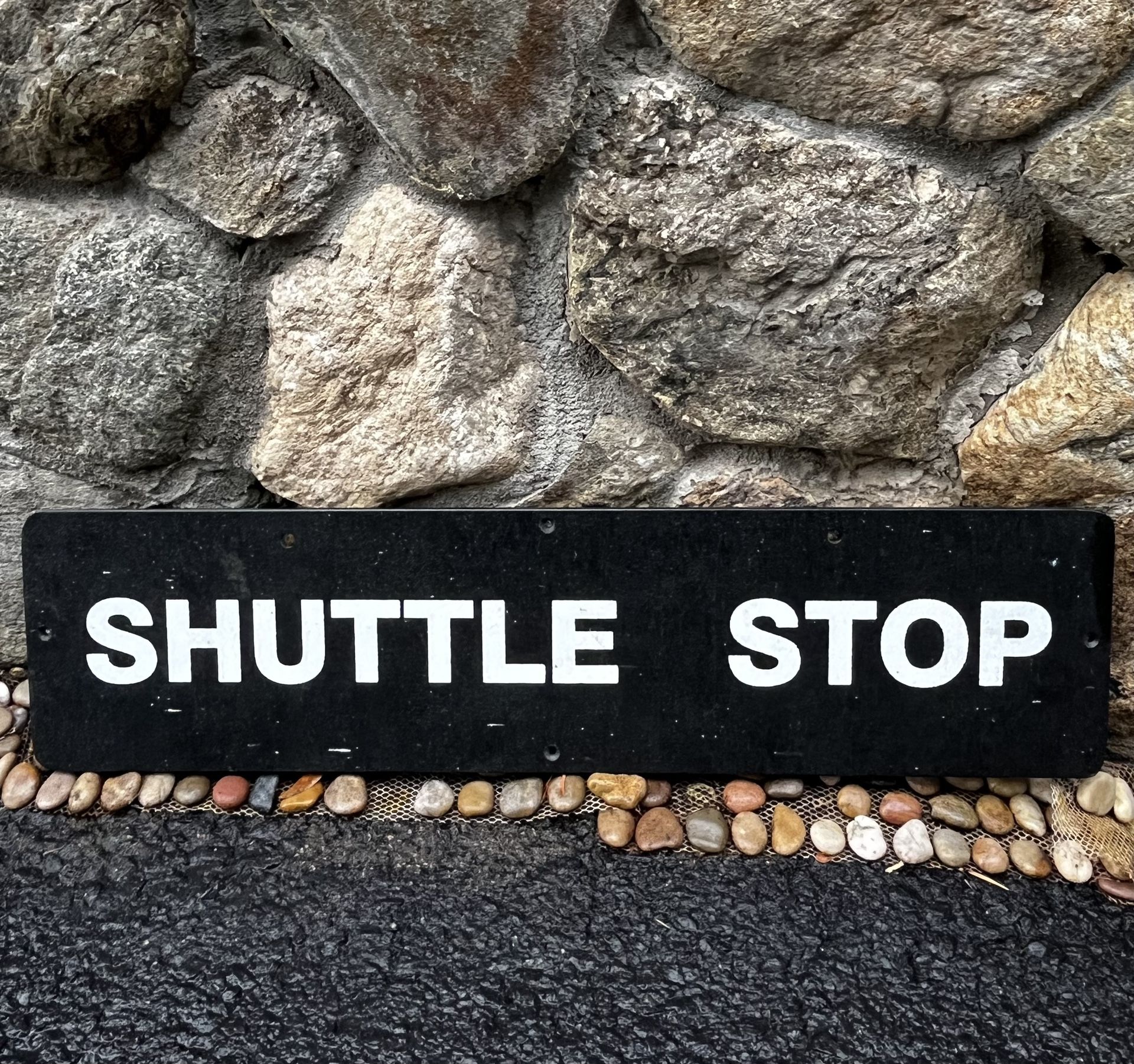 SHUTTLE STOP sign