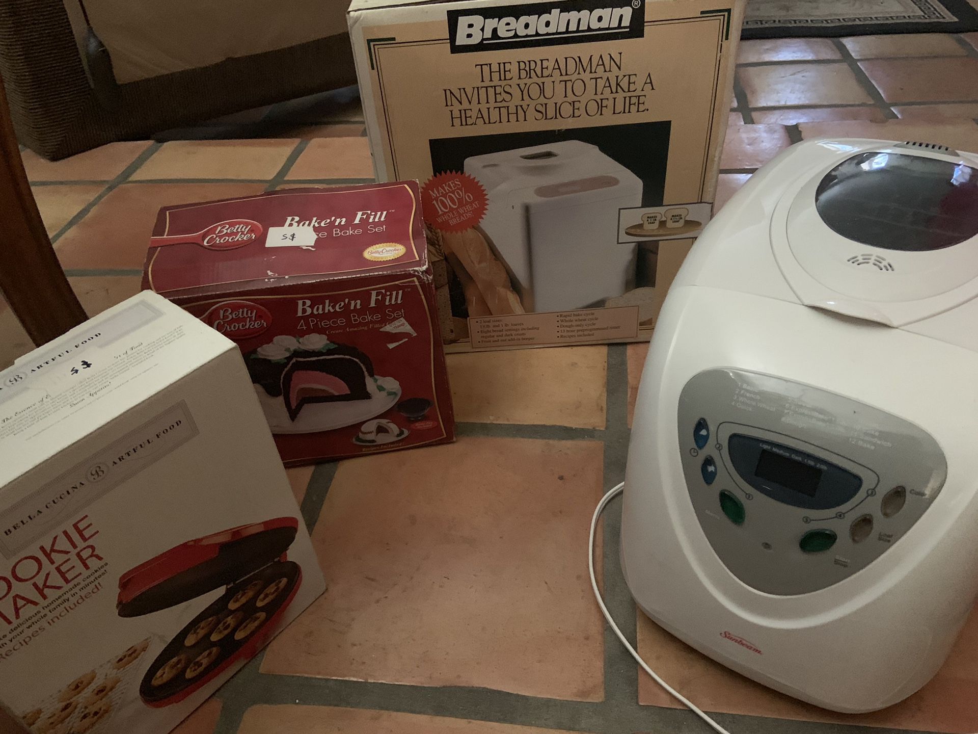 Two bread makers, baked fill, cookie baker -all for 50