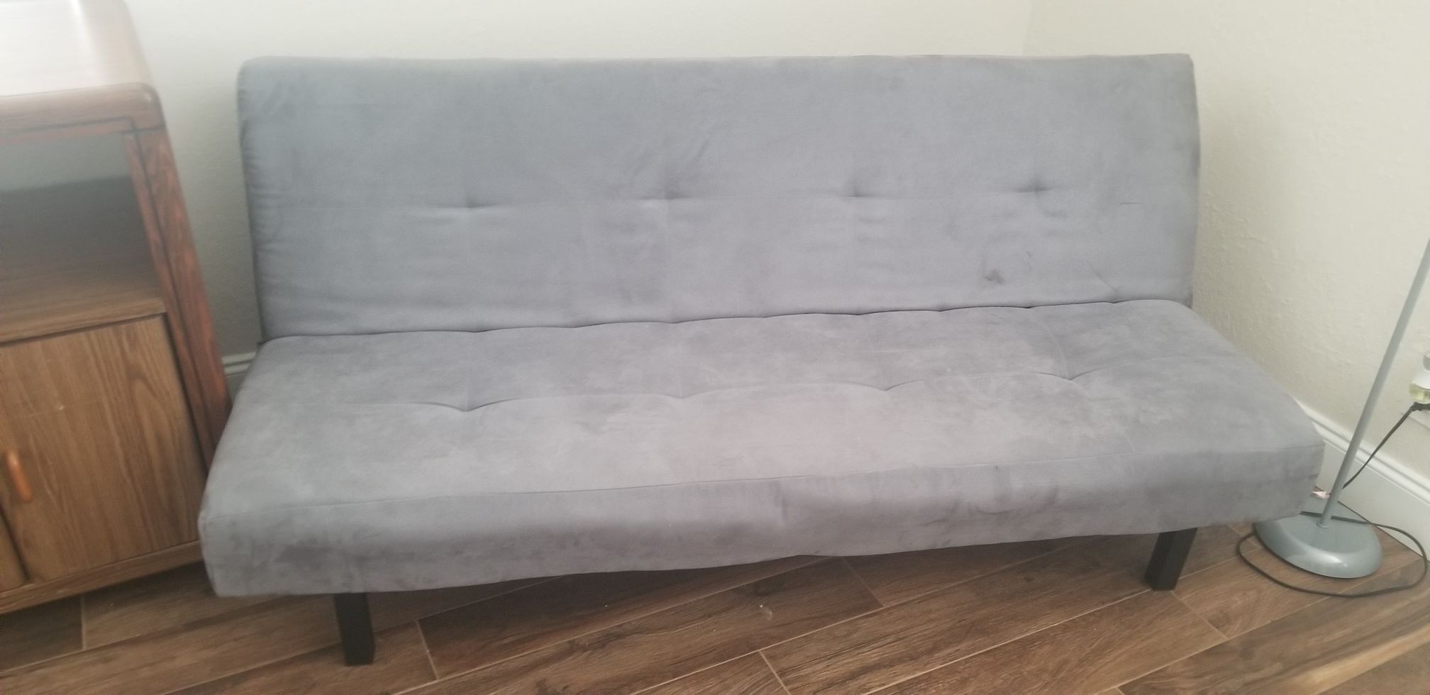 Gray futon (folds into a bed)