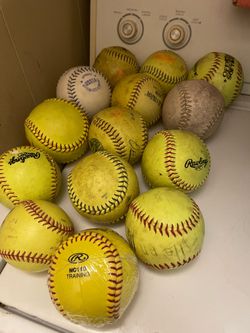 14 Softballs. ( used )