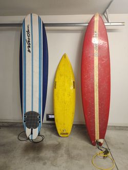 Two 9ft surfboards and one freebie