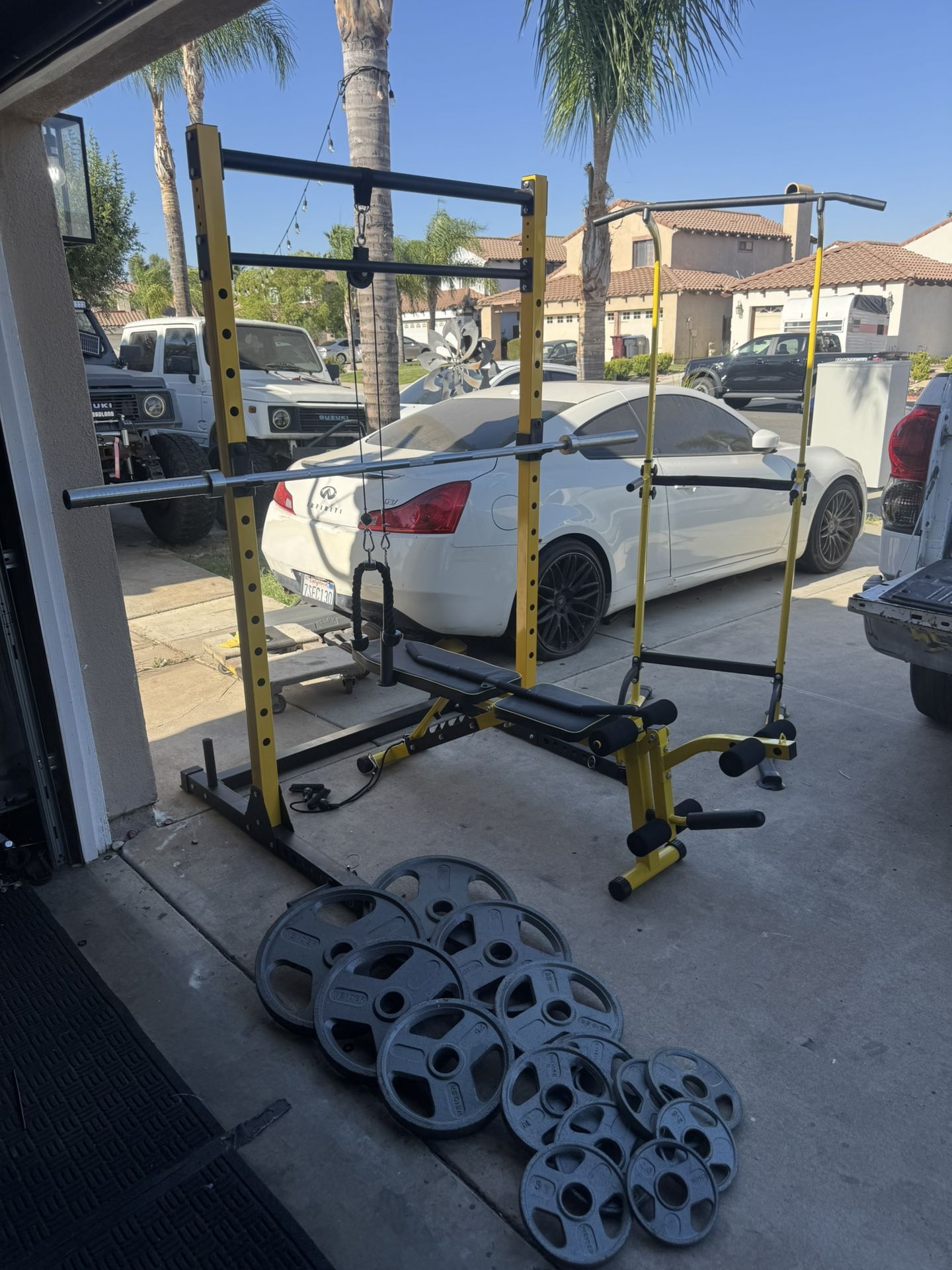 Bench press/squat rack with 7ft 45lbs bar plus 255lbs of Olympic weights and power tower