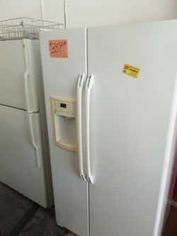 SALE GE side by side refrigerator white 36" works great clean . Warranty . Delivery available . 2203 Fowler st. Ft. Myers 33901