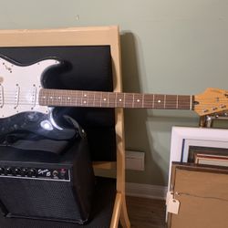 fender squier series stratocaster and amp