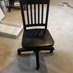 Used wooden chair with wheels