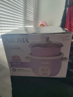 Purple rice cooker with steamer lid