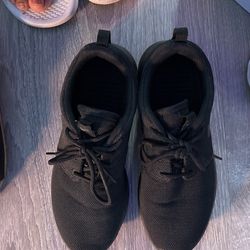 Worn Black Nike Sneakers