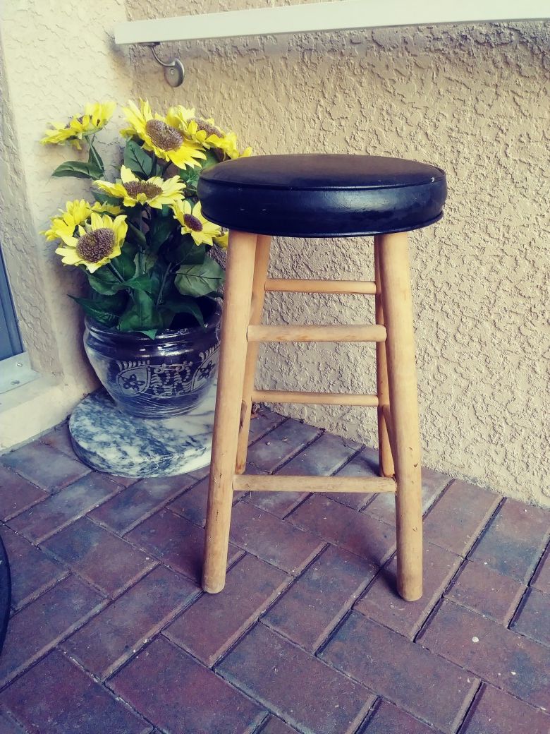 Wooden bar stool with black cushion.24inches