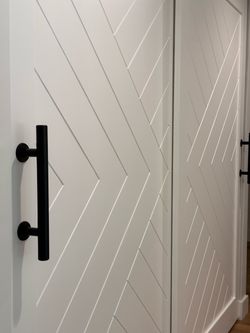 White Herringbone closet Door with Matte Black Pull Handle