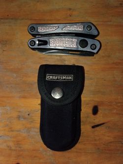 Craftsman 10-in-1 Mini Multi-Tool accompanied by its branded black nylon storage sheath.