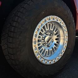 17x9 KMC Aztec Wheels And Tires 285/70/17 Nitto Terra Grappler 