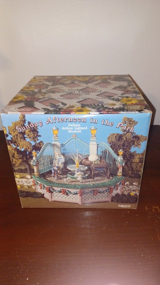 vintage Enesco "Sunday Afternoon in the Park" musical figurine.