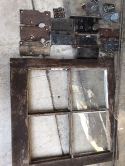 75-100 yr old original solid wood speak easy/window frame door w 2 panels of original glass.