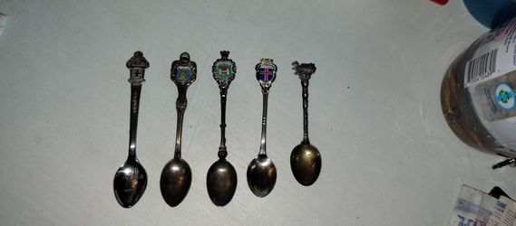 Rolex and assorted spoons
