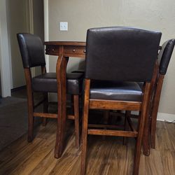 Wooden table- glass top & 4 chairs